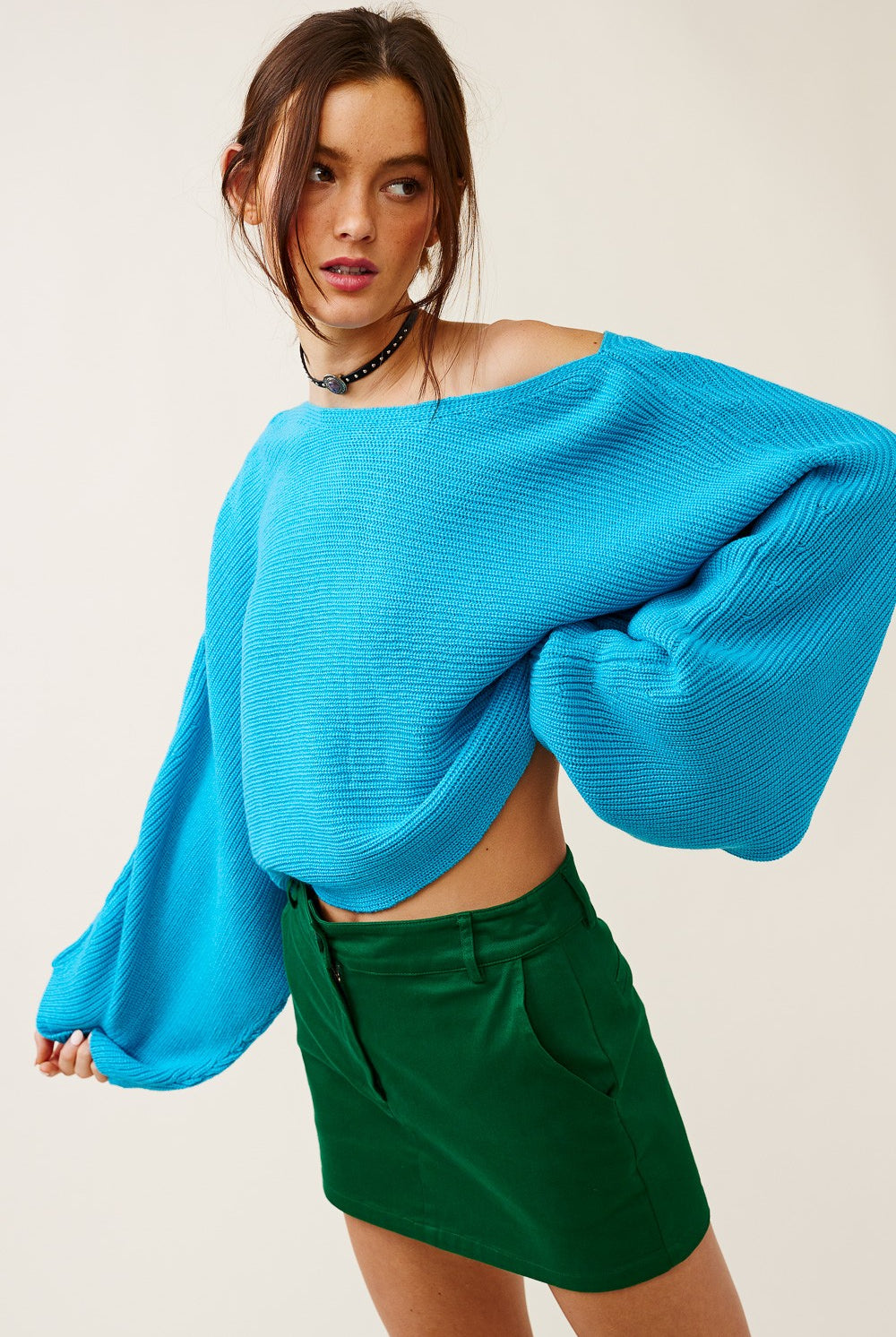 Vibrant turquoise boat neck sweater, perfect for transition weather outfits