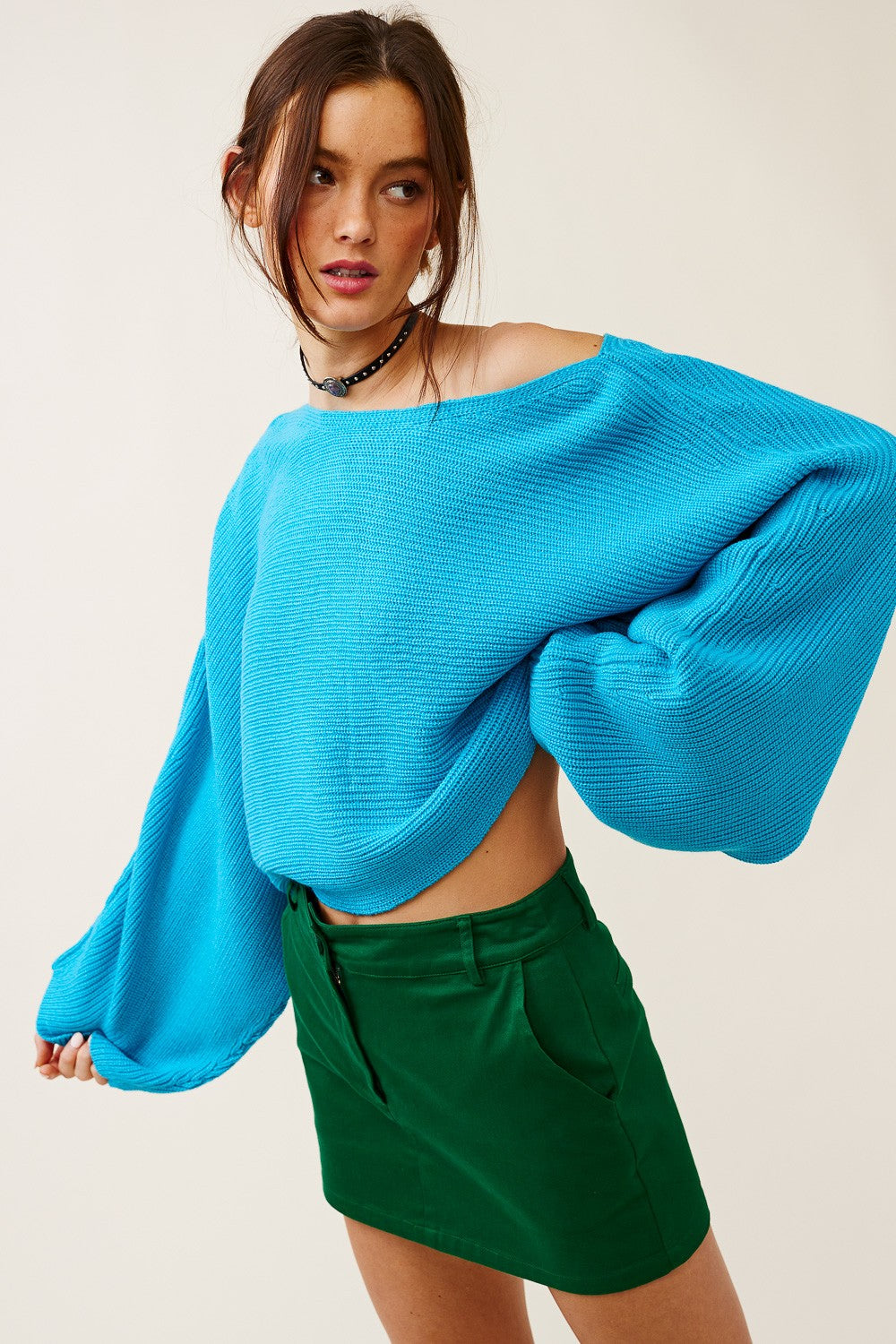 Vibrant turquoise boat neck sweater, perfect for transition weather outfits