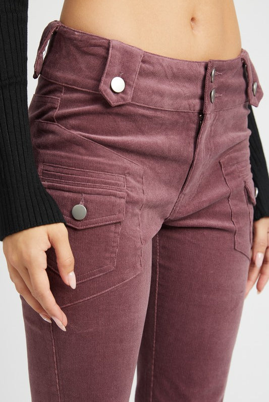 Detailed view of the front zipper button closure and waistband on corduroy pants