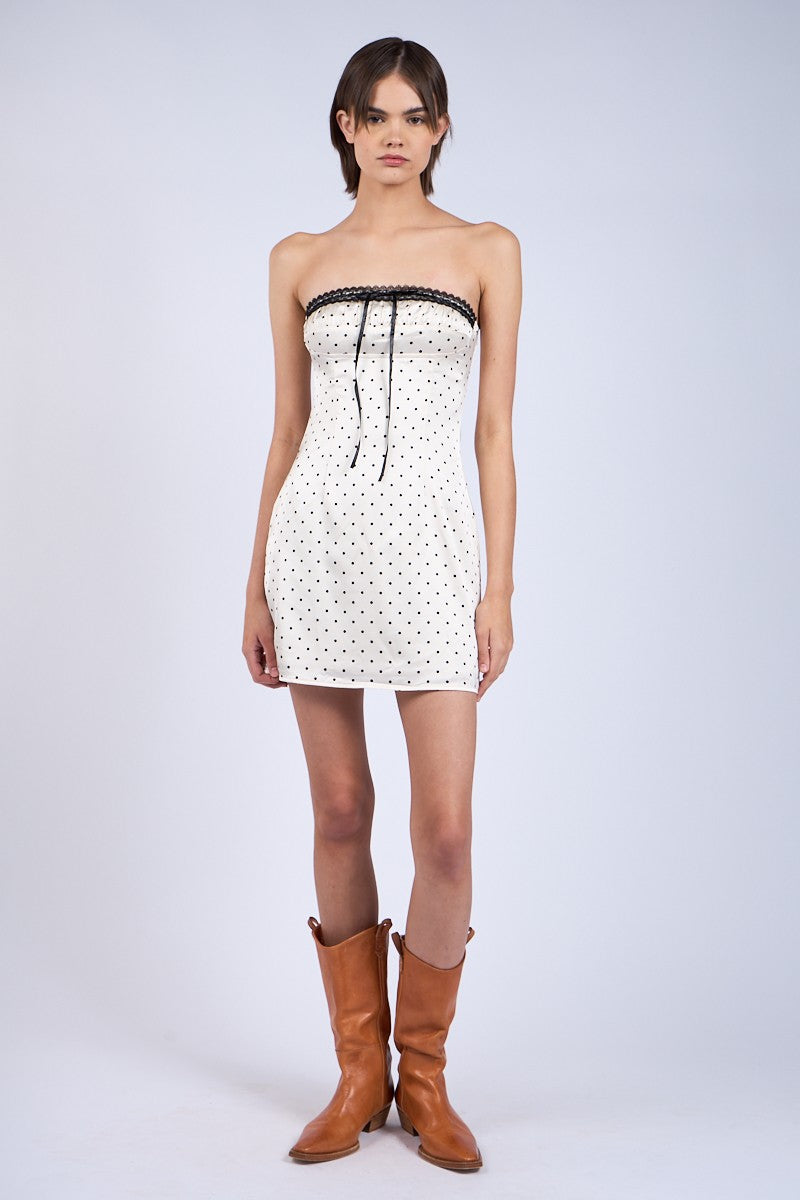 Model wearing ivory strapless party dress for birthdays or date night