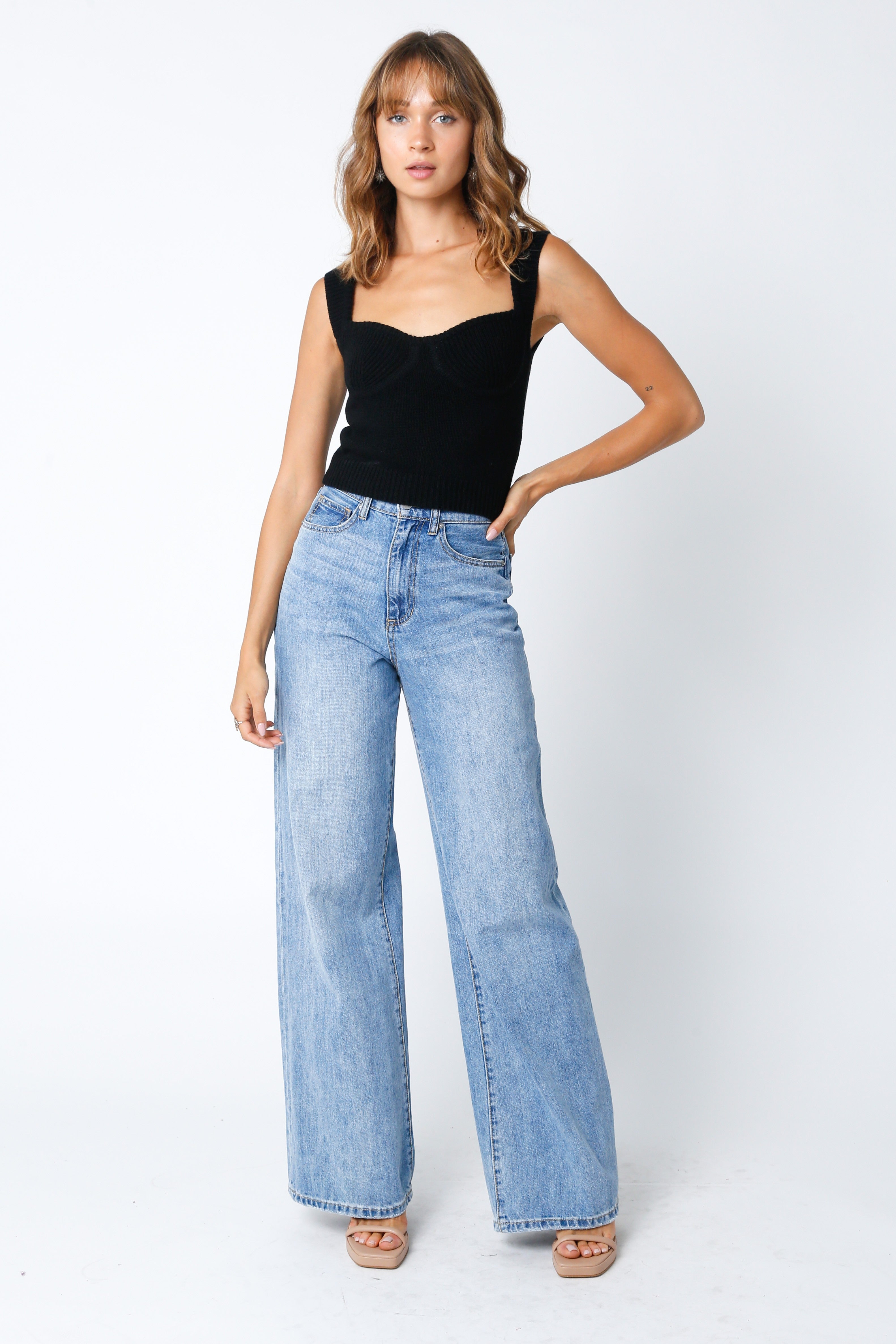 Structured black knit bustier top featuring wide straps and premium wool blend fabric.