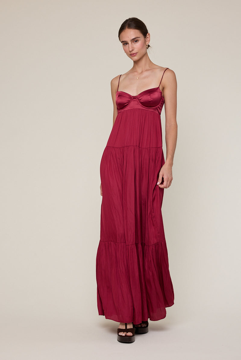 Flowy burgundy tiered maxi dress for formal evening celebrations.