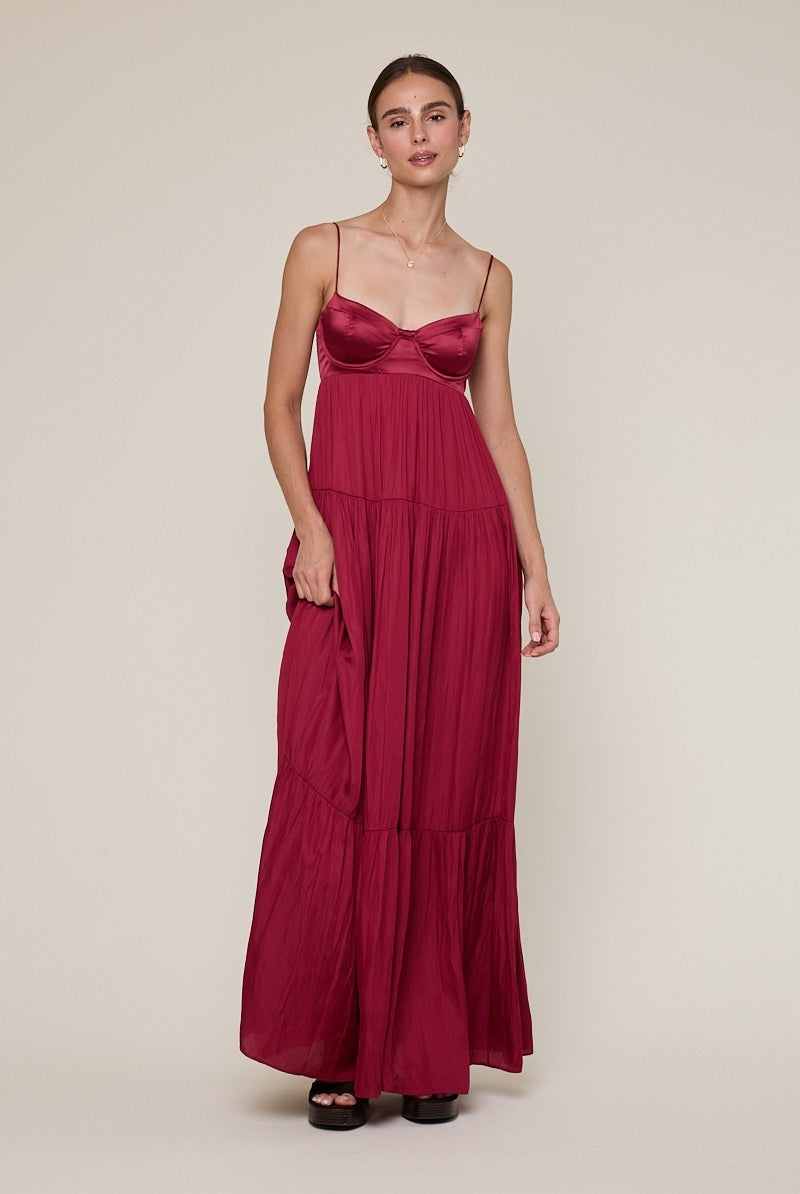 Burgundy satin bustier maxi dress for prom or black-tie wedding guests.