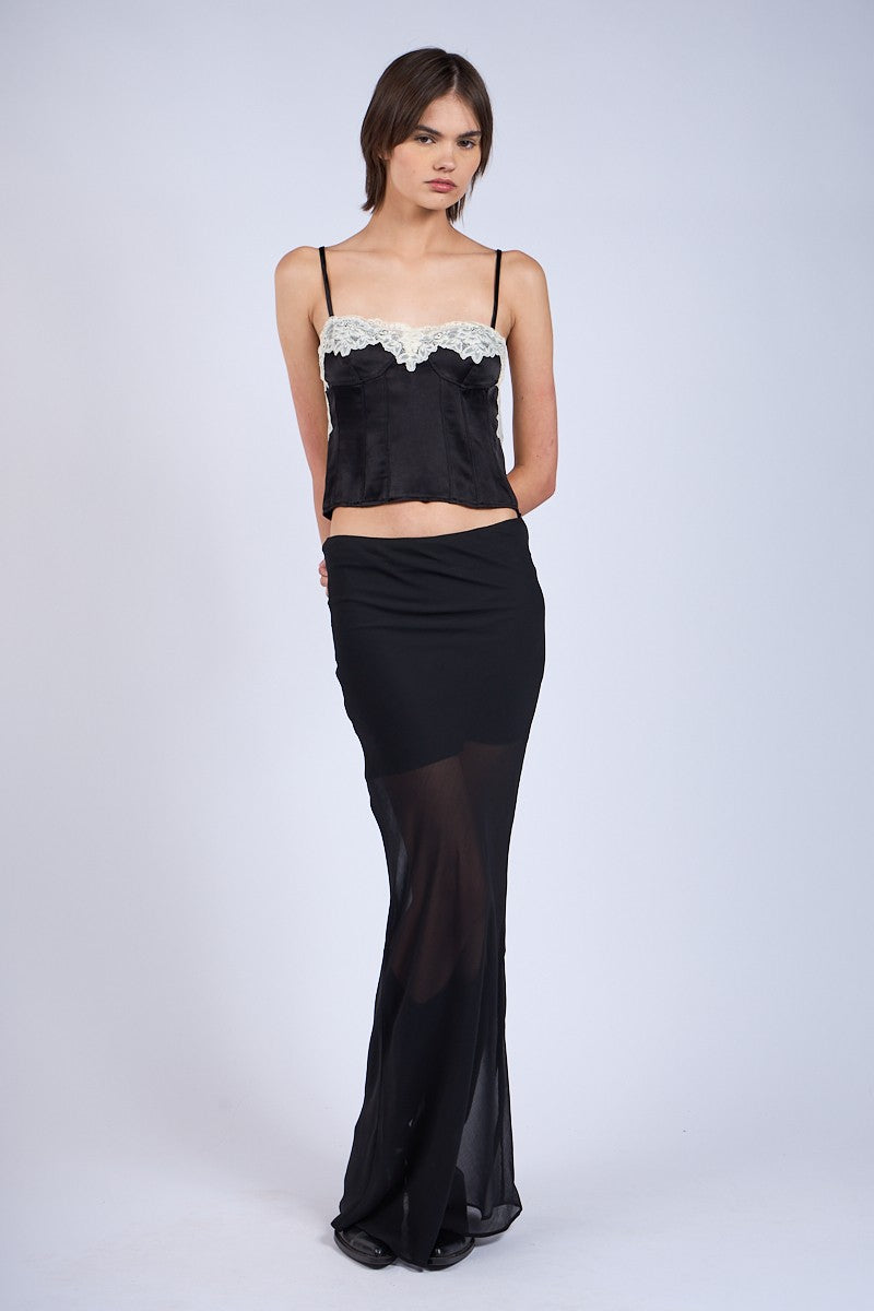 Y2K-inspired black satin cami top with lace trim for a night out.