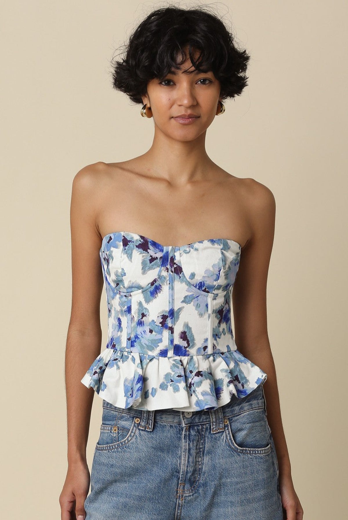 Front view of Dani strapless corset top featuring a strapless neckline and blue floral print