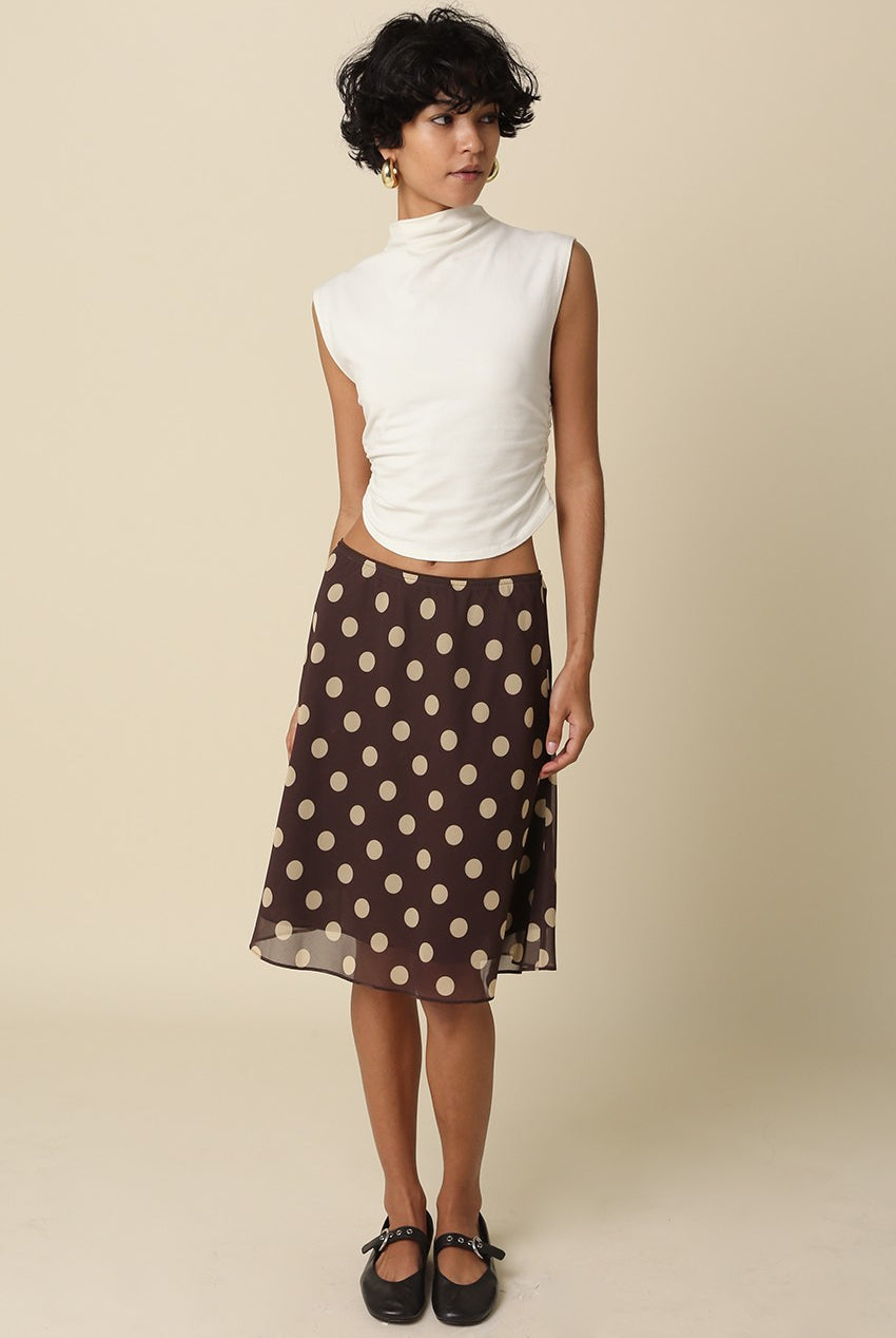 Model styling the Emily brown mesh midi skirt for a breezy, feminine look