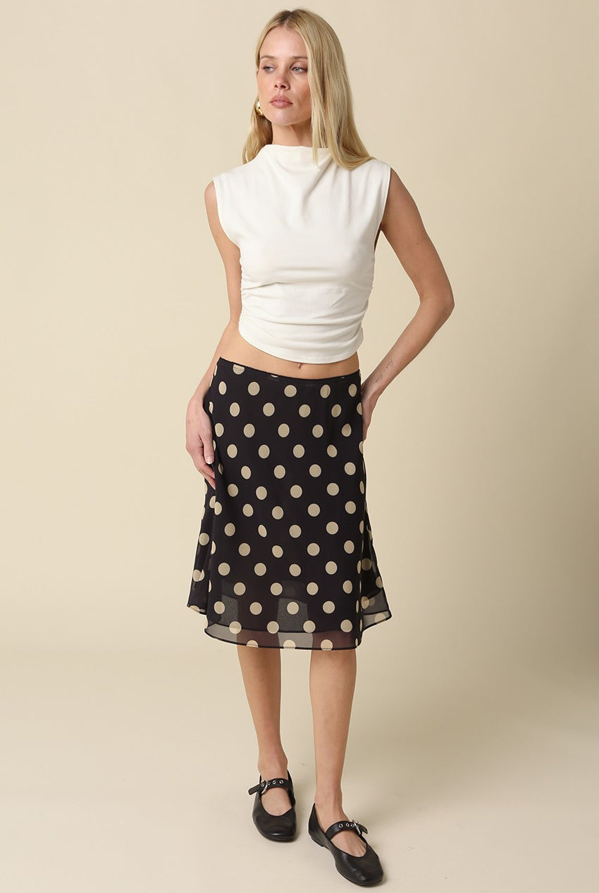Full length shot of the Emily polka dot midi skirt in a breezy, A-line silhouette