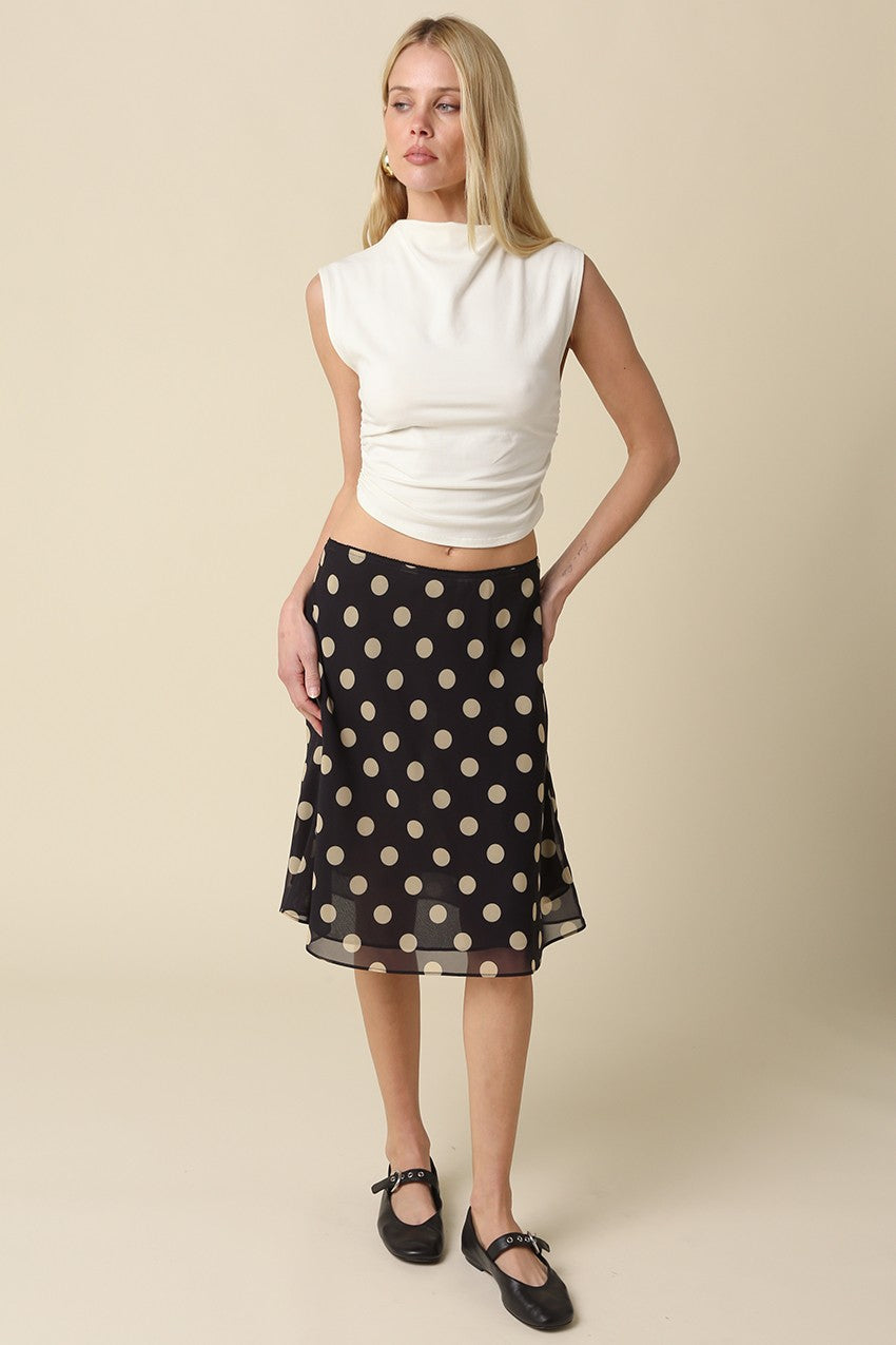 Full length shot of the Emily polka dot midi skirt in a breezy, A-line silhouette