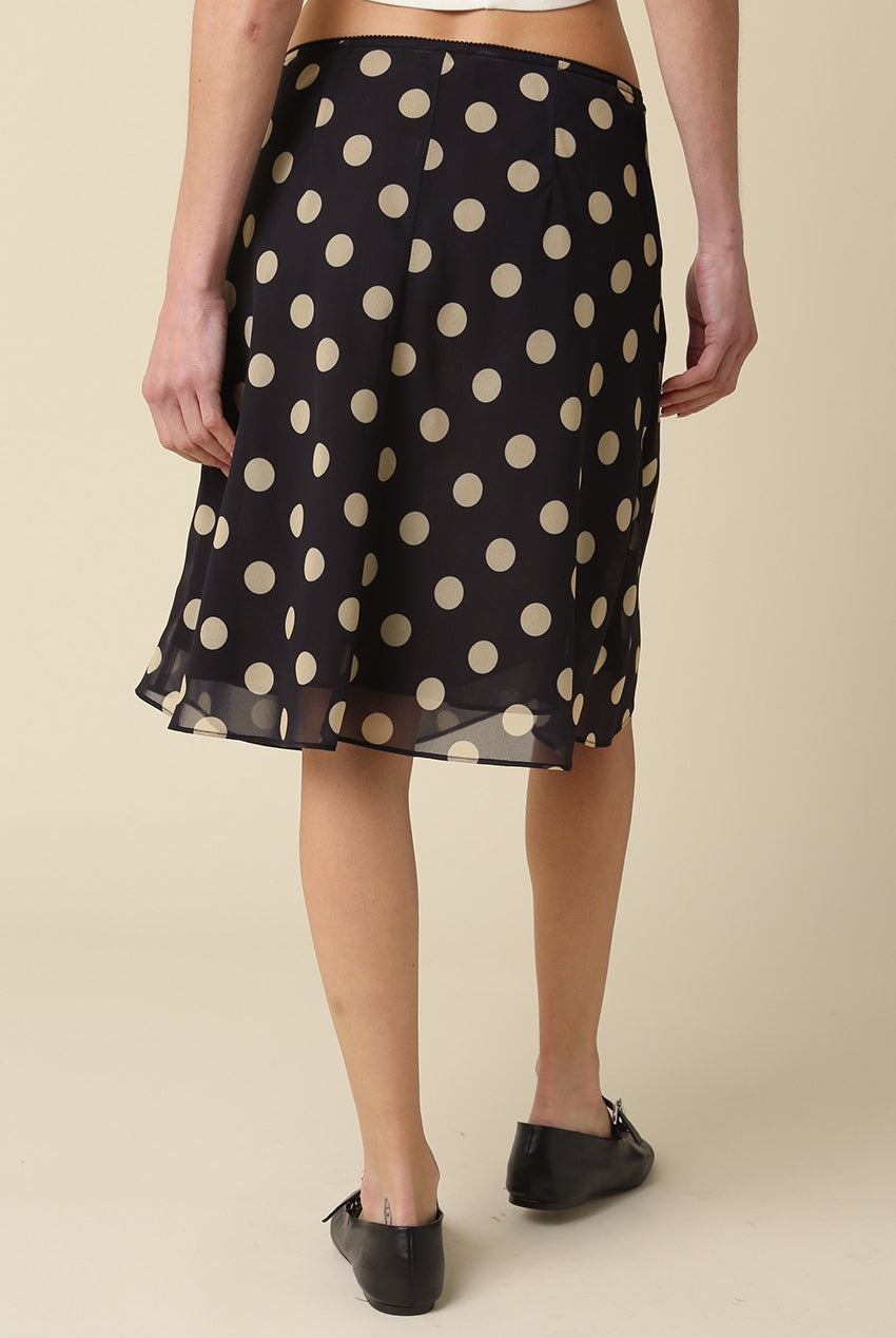 Back view of the Leia polka dot mesh midi skirt showing the lightweight flowy drape