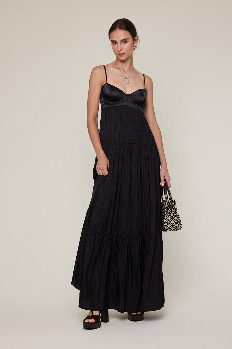 Flowy black tiered maxi dress for formal evening celebrations.