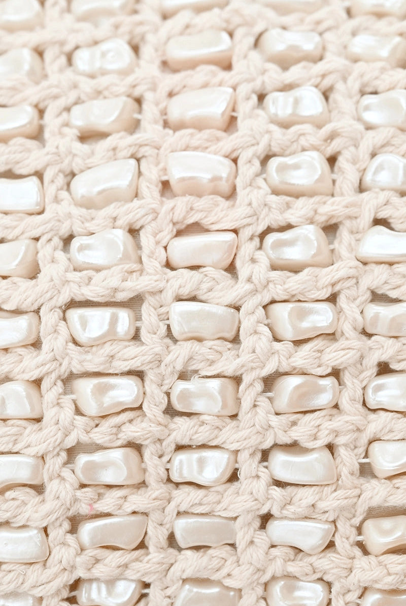 crochet and pearl clutch close up view