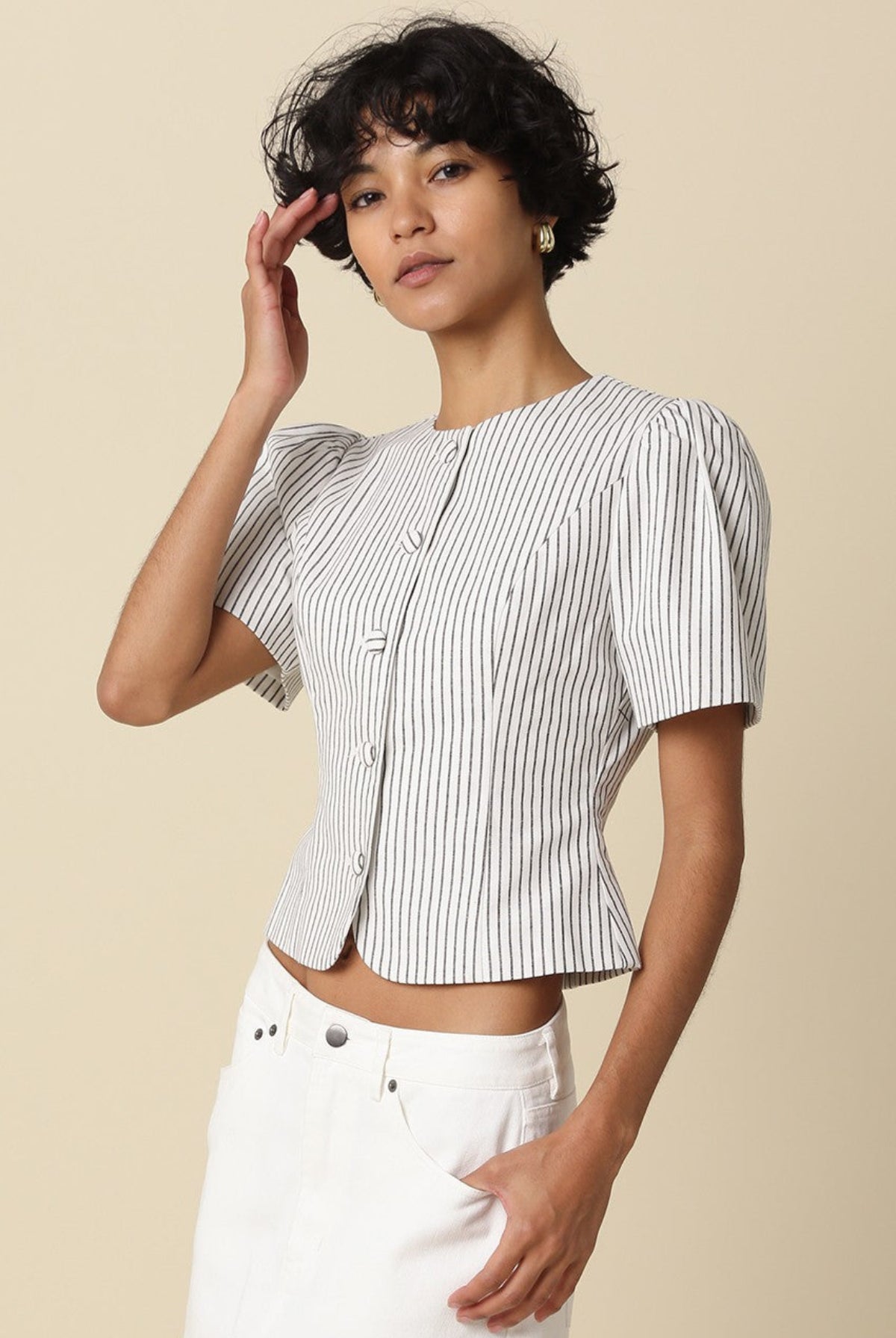 white and black stripped puff sleeve top side angle view