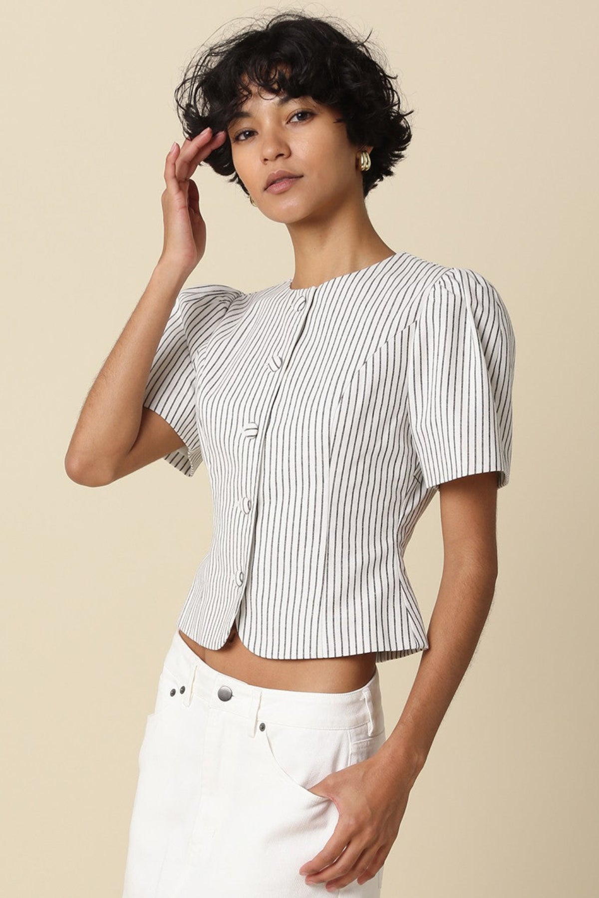 white and black stripped puff sleeve top side angle view