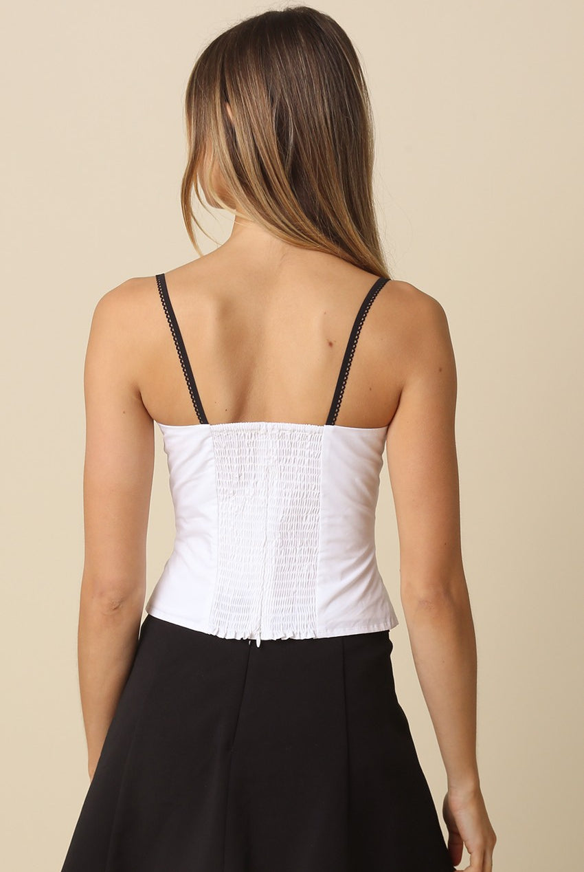 The back of the Devyn top highlighting the stretchy smocked panel and hidden zipper for a comfortable fit