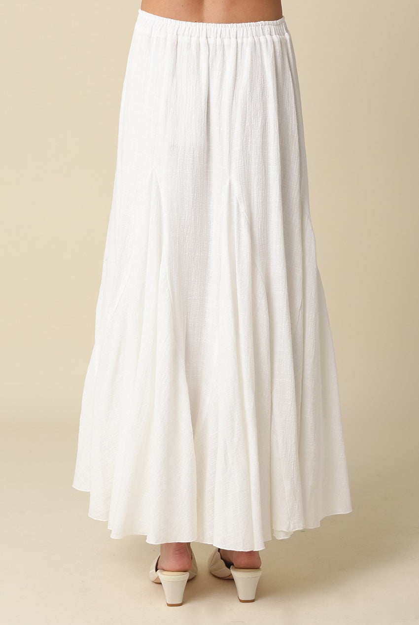 Full-length white textured godet skirt for women with an elasticated waistband.