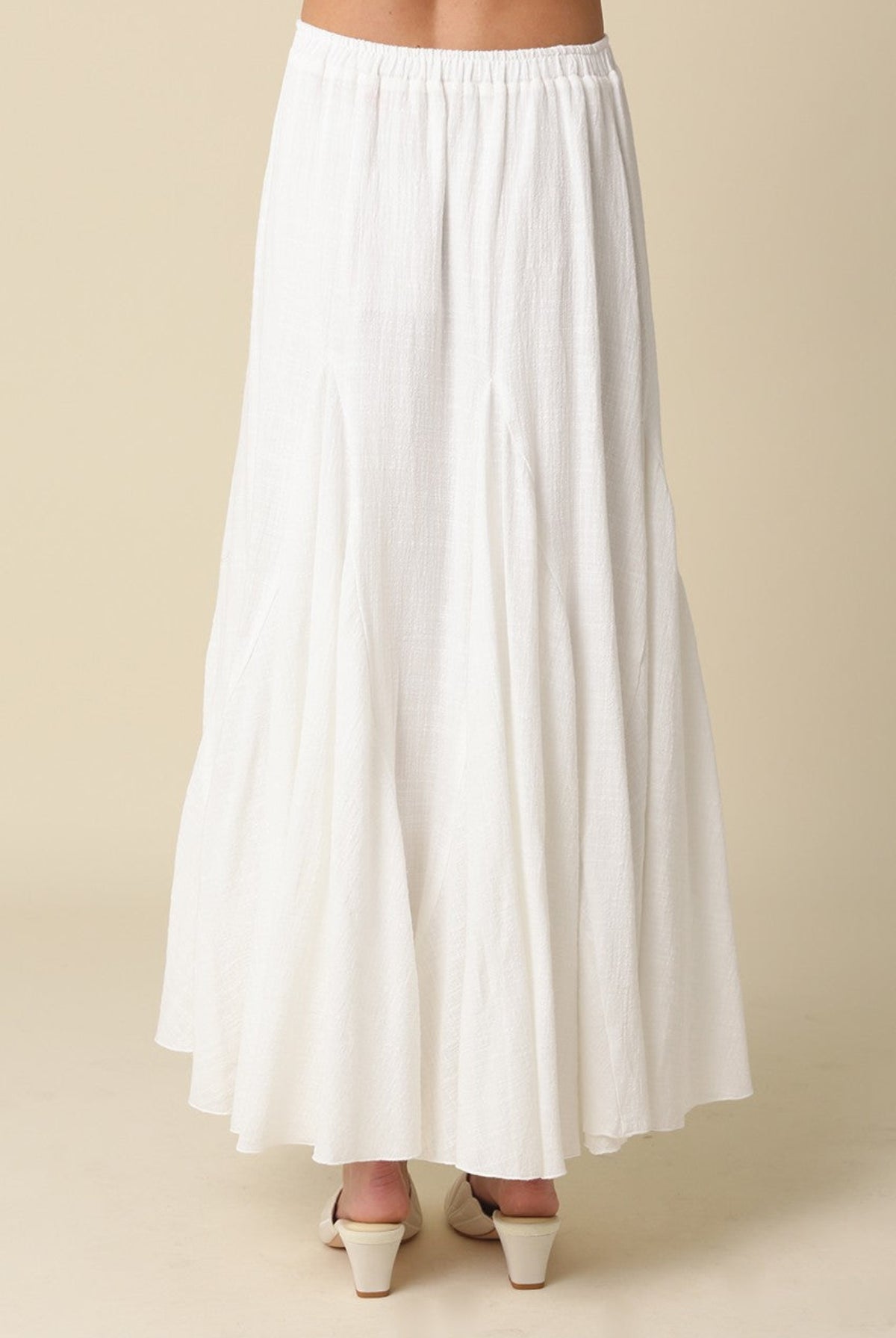 Full-length white textured godet skirt for women with an elasticated waistband.