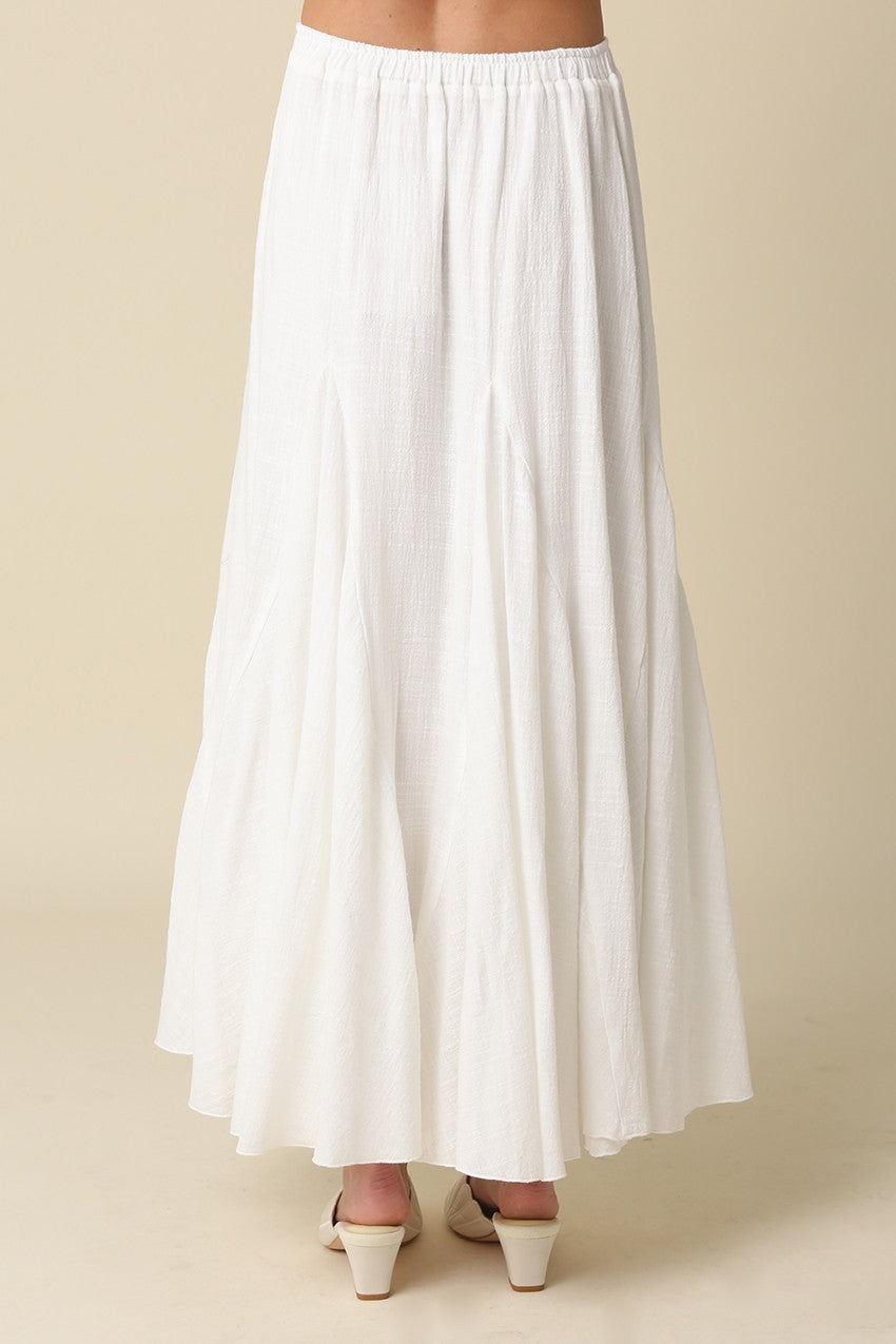 Full-length white textured godet skirt for women with an elasticated waistband.