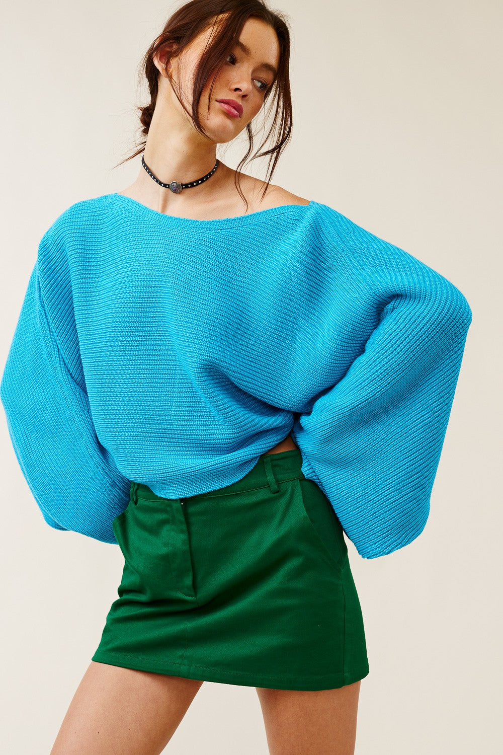 Oversized turquoise ribbed knit sweater with drop shoulders and a cropped fit.