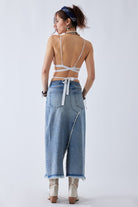 Back view of Must Be denim maxi skirt showing five pocket design