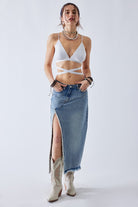 Close-up of crossover waist detail on the denim on the Be Mine Maxi Skirt