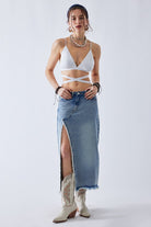Model wearing a denim maxi skirt with boots for a boho street style look