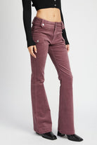 Close-up of the wine colored corduroy fabrication and side cargo pocket detail