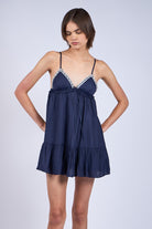 The Annie Navy Babydoll Dress is the perfect cute birthday party dress, featuring a tiered skirt and lace trim for a celebration-ready look.