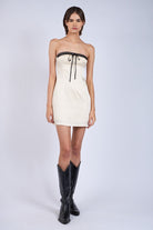 Ivory bodycon mini dress for graduation or bachelorete outfit.