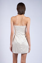 Back view of Laney ivory mini dress showing hidden zipper and bodycon fit.