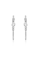 A pair of large silver-toned hoop earrings featuring clear crystals stones