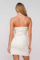 Back view of the Katie white corset mini dress showing the tailored fit.