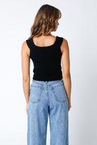 Back view feminine black sweater corset top with sweetheart neckline for a fitted silhouette.