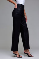Close-up of black coated denim fabric on the Abby wide-leg jeans showing the sleek, waxy texture.
