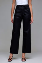 Abby black coated wide-leg dad jeans featuring a leather-like sheen and high-waisted relaxed fit.