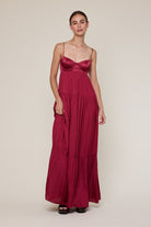 Burgundy satin bustier maxi dress for prom or black-tie wedding guests.