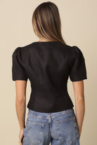 Black puff sleeve linen button-down top with round neck back view.