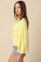 Butter yellow dolman sleeve knit top with wide sleeves