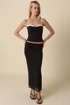 A chic night-out look featuring the Devyn black contrast corset top