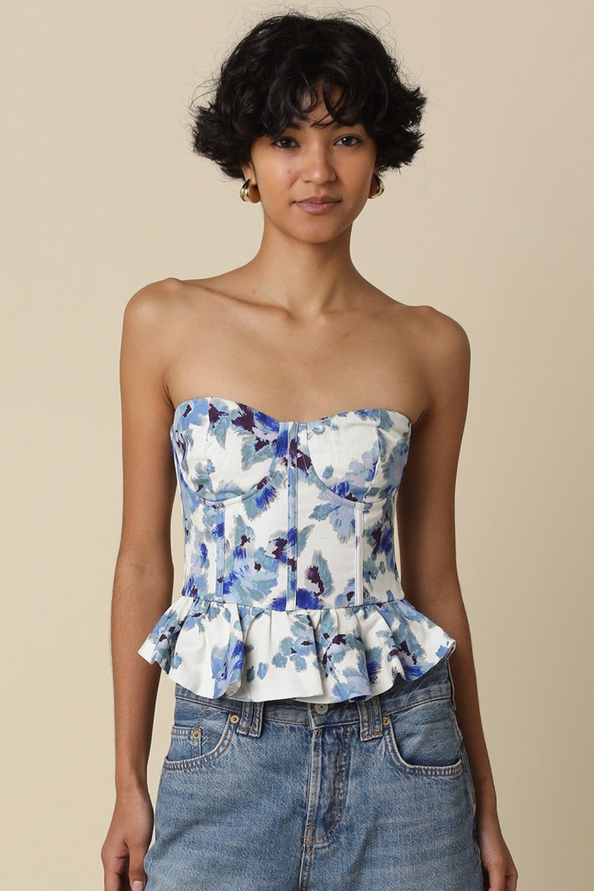 Front view of Dani strapless corset top featuring a strapless neckline and blue floral print