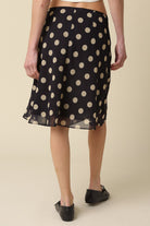 Back view of the Leia polka dot mesh midi skirt showing the lightweight flowy drape