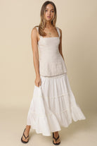 Lightweight white cotton maxi skirt with tiered silhouette