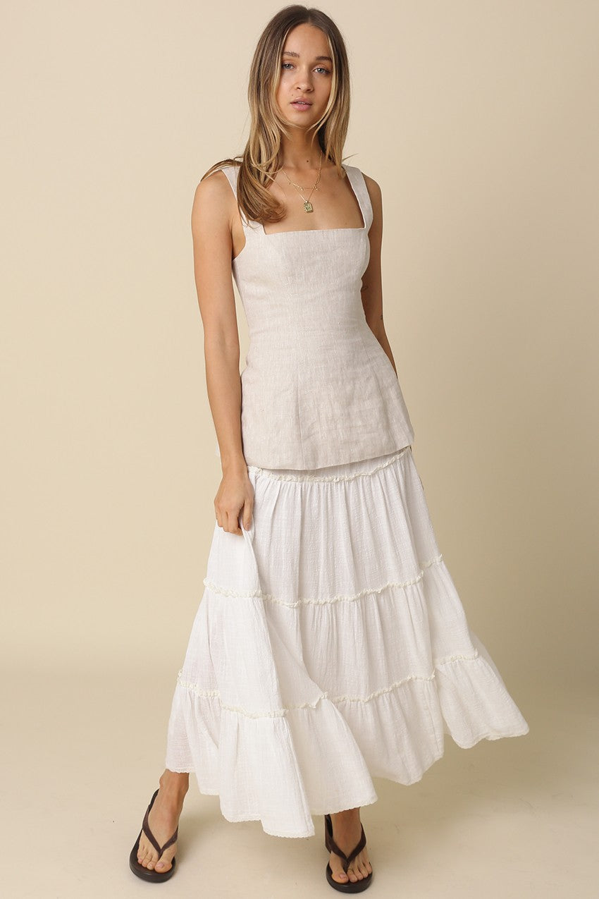 Lightweight white cotton maxi skirt with tiered silhouette