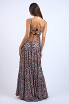 Back view of black floral corset dress with cutout open back and straps