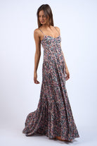Side view of black floral maxi dress showing structured corset bodice.