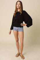 Black dolman sleeve top with wrap tie back
