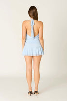 Back view of the light blue Jenni mini dress showing the open back 