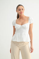 White puff sleeve corset top with sweetheart neckline