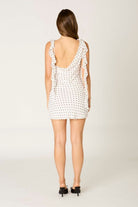 katie white polka dot ruffle mini dress back view