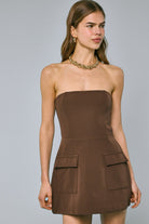 Model wearing Lara brown strapless mini dress with built-in shorts for graduation or sorority rush.