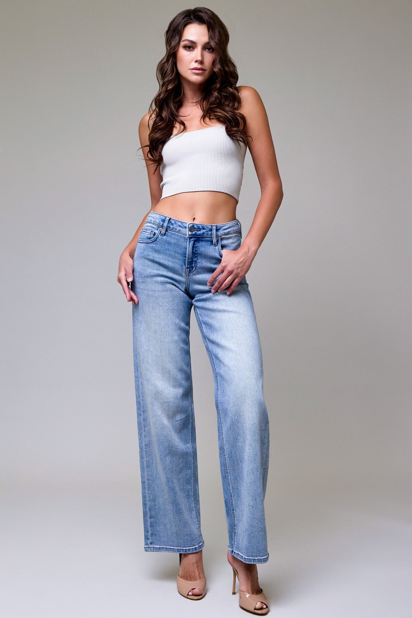 Monica light wash mid rise dad jeans featuring a relaxed wide leg silhouette and vintage blue denim.